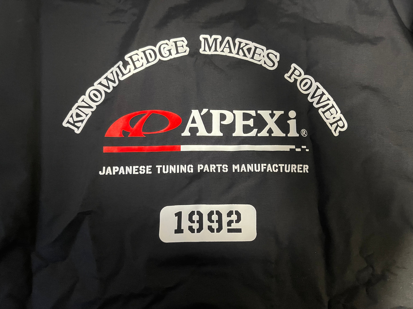 A'PEXi Knowledge Makes Power Windbreaker